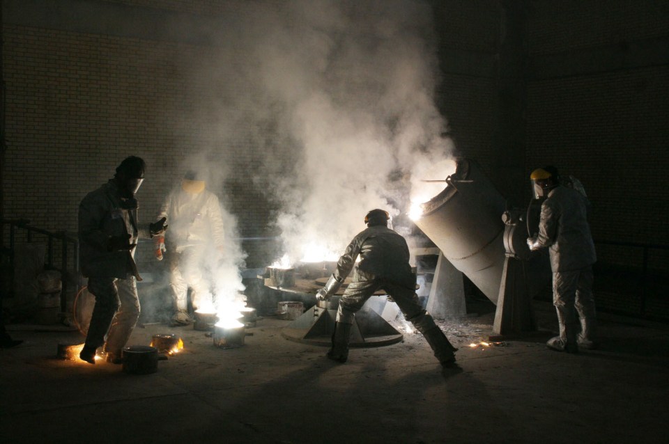  Men work inside of an uranium conversion facility just outside the city of Isfahan, about 254 miles south of capital Tehran