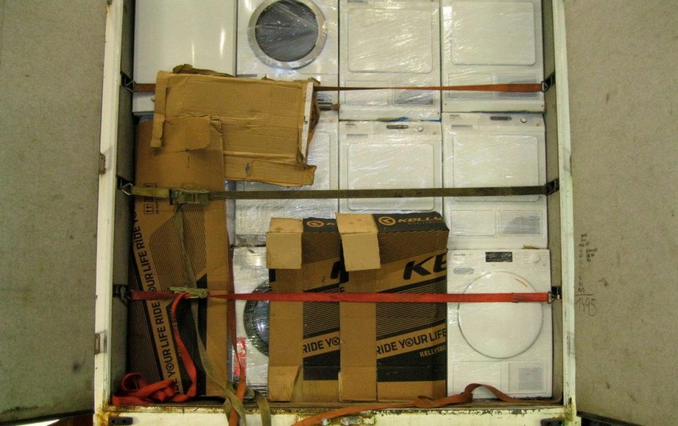  The young teen was smuggled into England in a washing machine box. Above, the back of a people smuggler's lorry