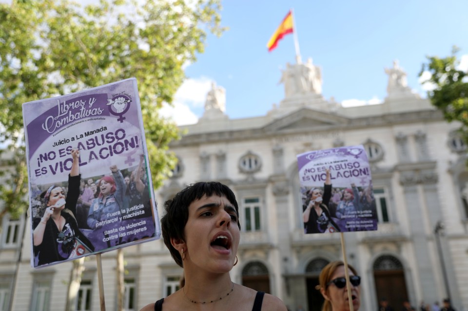  A woman stood outside the Supreme Court in Madrid holding a sign that reads: 'It's not abuse, it's rape'