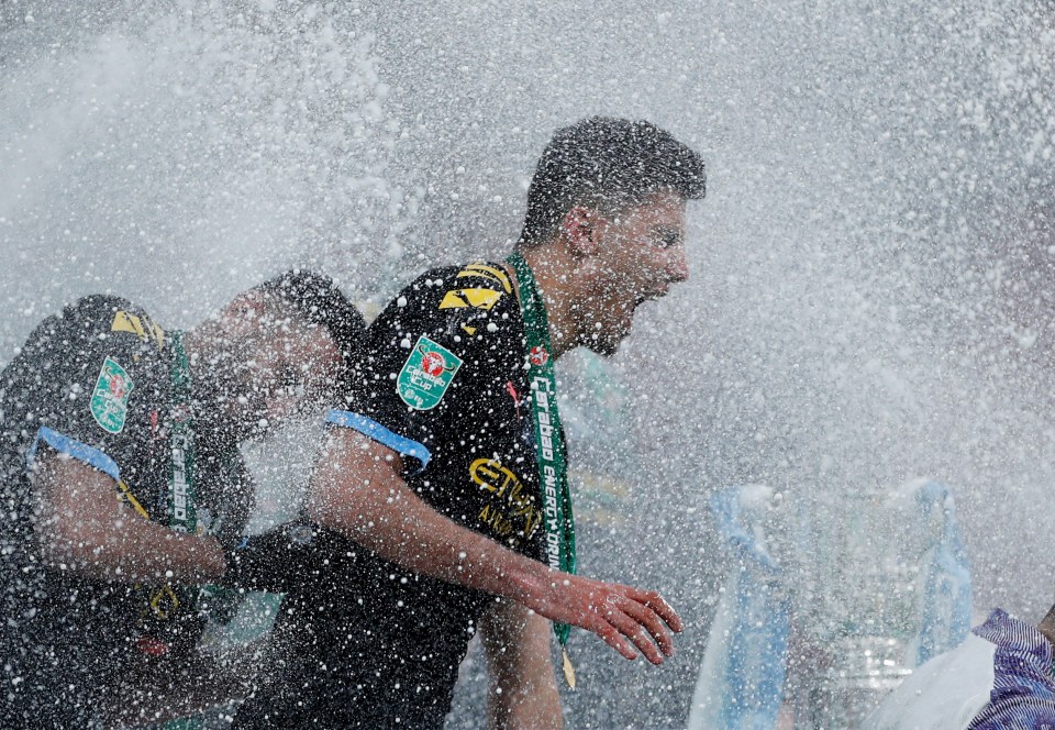  Goalscorer Rodri was among those drenched in sparkling wine