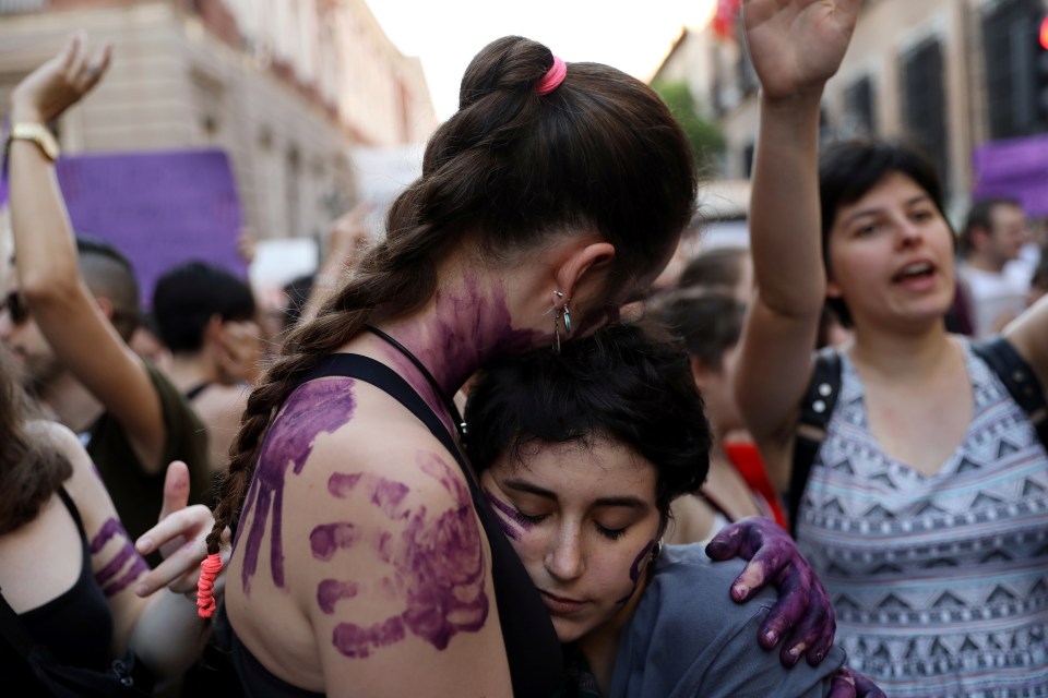  Protesters embrace during a demonstration against the release on bail of five men known as the "Wolf Pack" cleared of gang rape of a teenager and convicted of a lesser crime of sexual abuse in Madrid, Spain, June 22, 2018