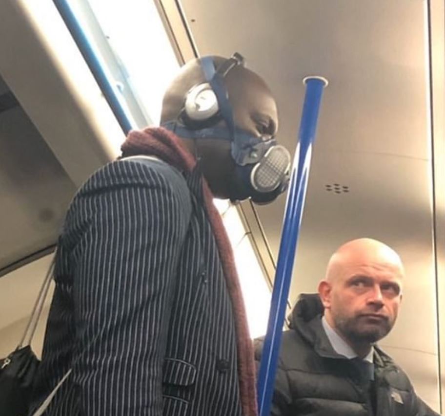  Another Brit wears a full-on gas mask - but a fellow commuter wasn't impressed