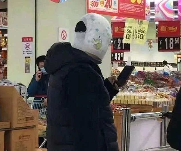  A man in China appears to wear a nappy on his head