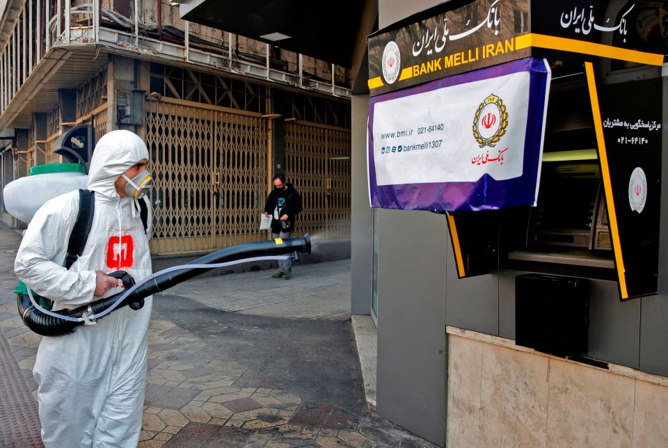  Street cleaners spraying disinfectant in Tehran as the death toll rose to 107