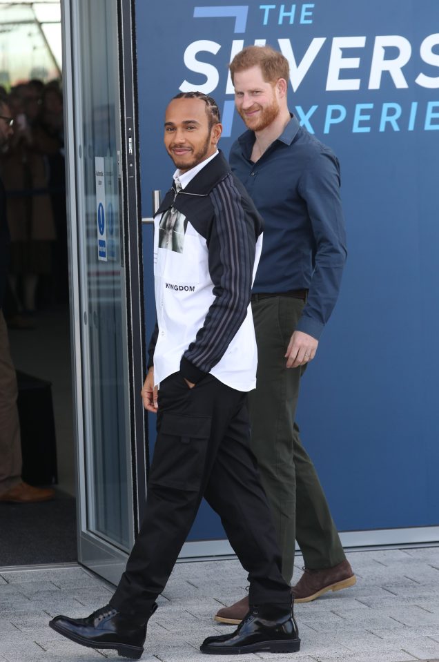  Harry has been joined by F1 star Lewis Hamilton as he opens the British motor racing museum at Silverstone