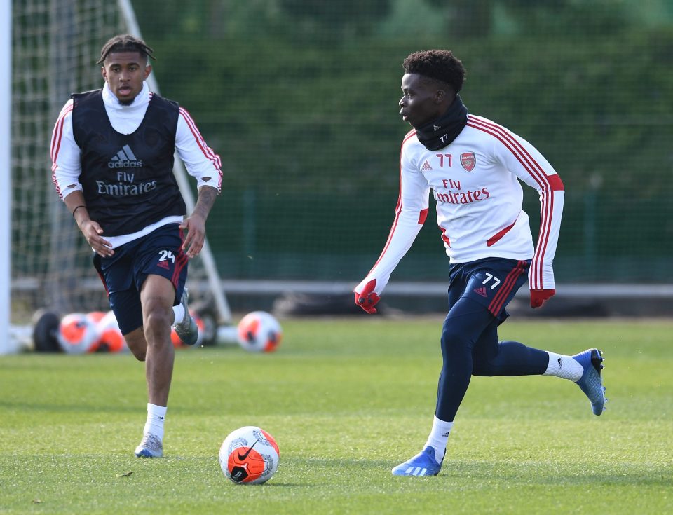 Mikel Arteta is giving youngsters like Bukayo Saka, right, and Reiss Nelson chances in the first team at the Emirates