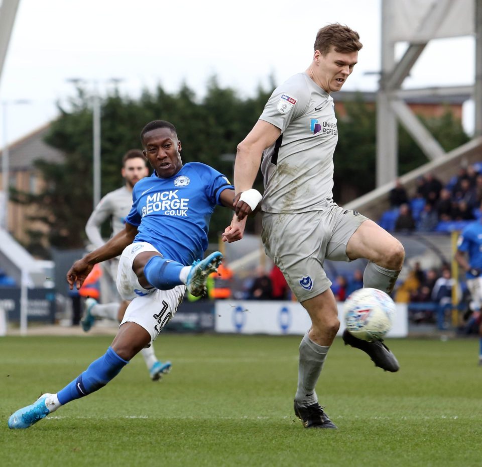  Norwich loanee Sean Raggett, right, has been diagnosed with coronavirus