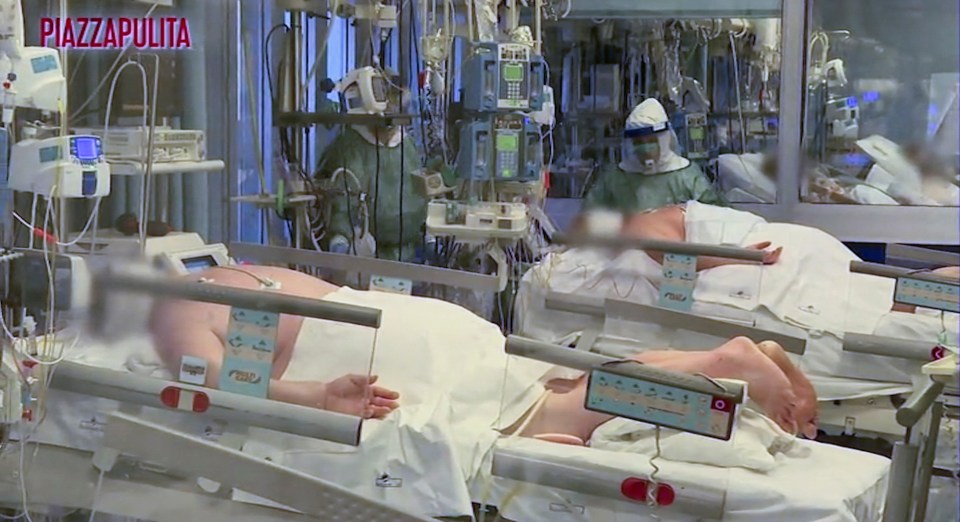  Medical staff in protective suits treat coronavirus patients in an intensive care unit at Cremona hospital in northern Italy