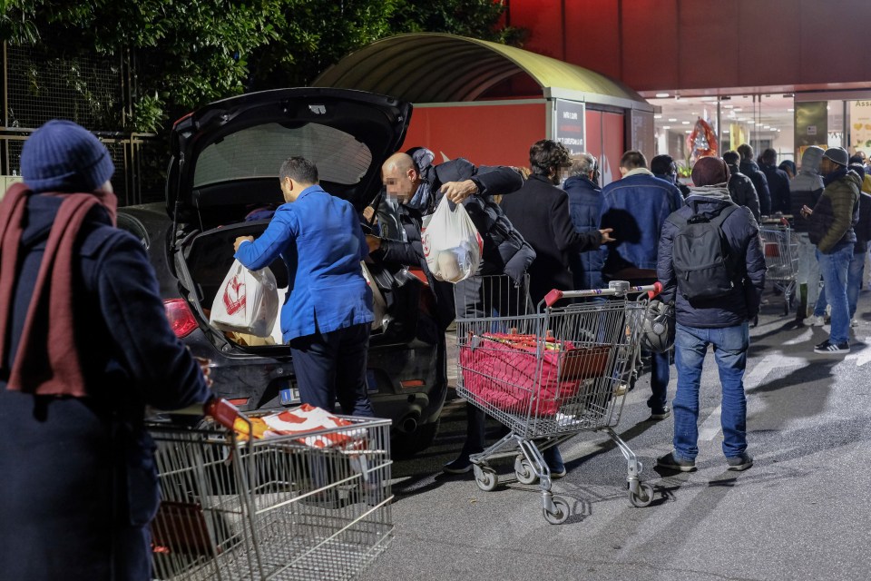  Shoppers stock up on essentials in the capital Rome