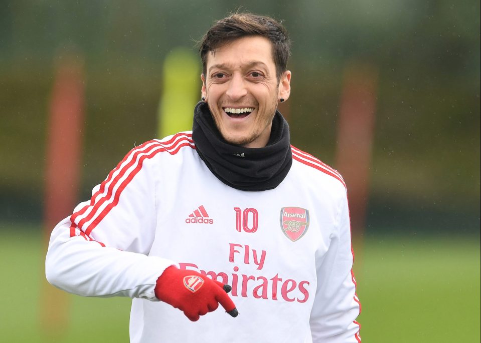  Mesut Ozil's agent insists the playmaker is happy at Arsenal despite links with Fenerbahce