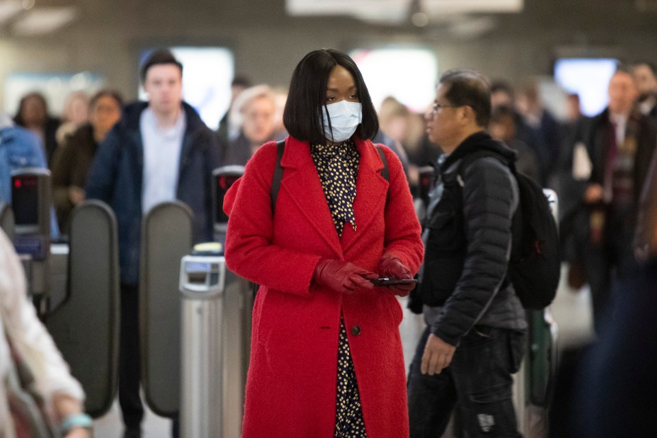  A woman seen wearing a face mask at Westminster Station in London