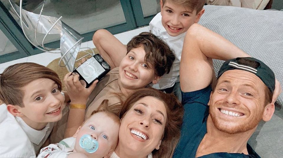  Stacey pictured with partner Joe Swash and sons Rex, Zachary, Leighton and Joe's son Harry (centre)