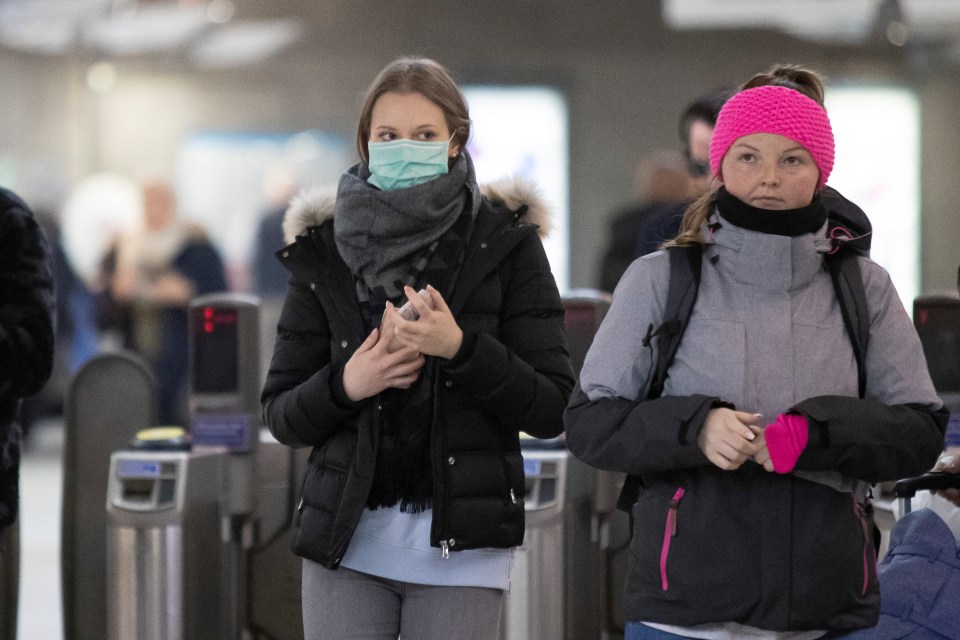  People have been seen wearing masks as they travel around London as coronavirus hits the country