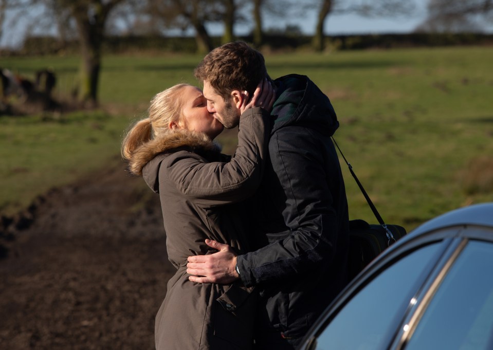  Belle and Jamie pucker up in Emmerdale