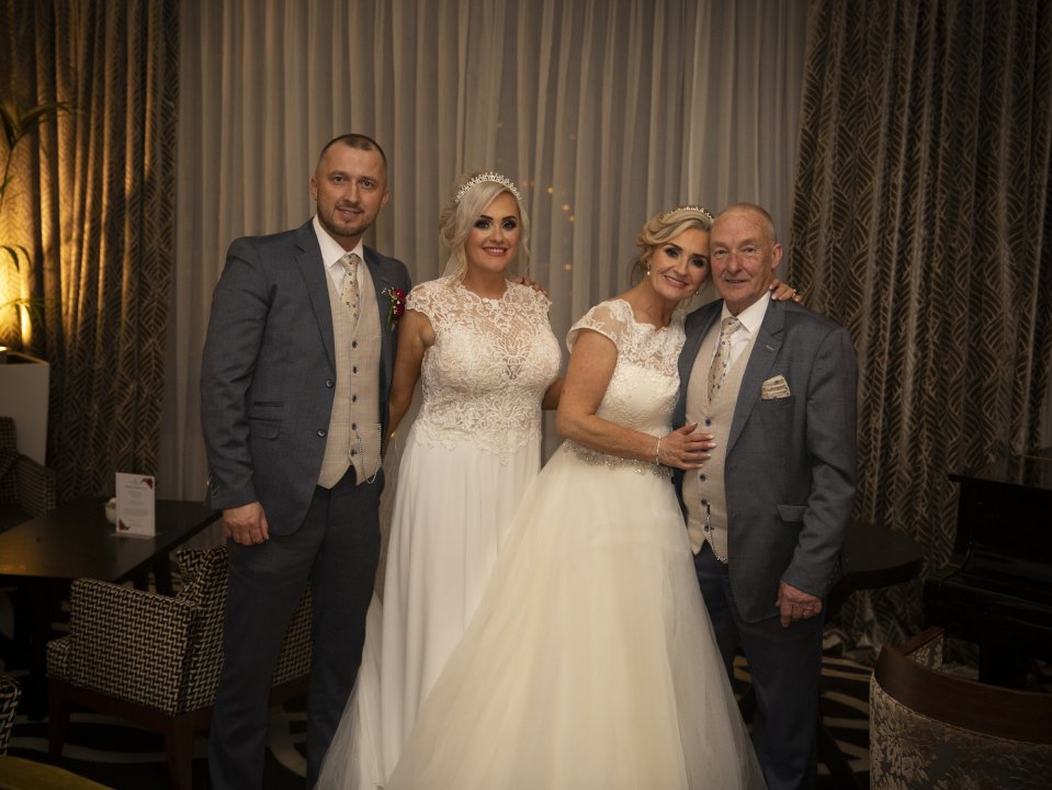  Trisha and Aisling pose with their husbands after getting hitched