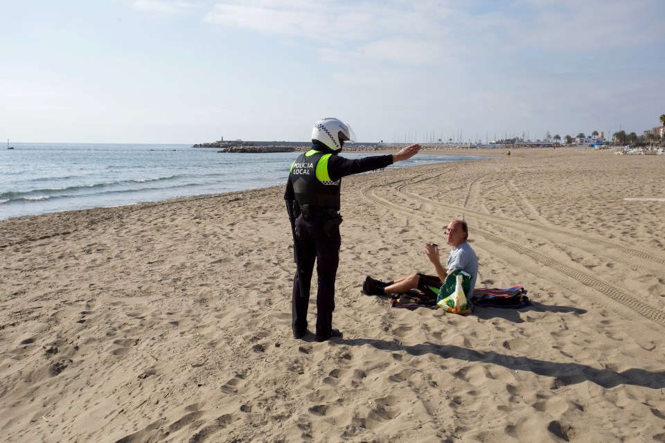  A man is ordered off the beach in Spain