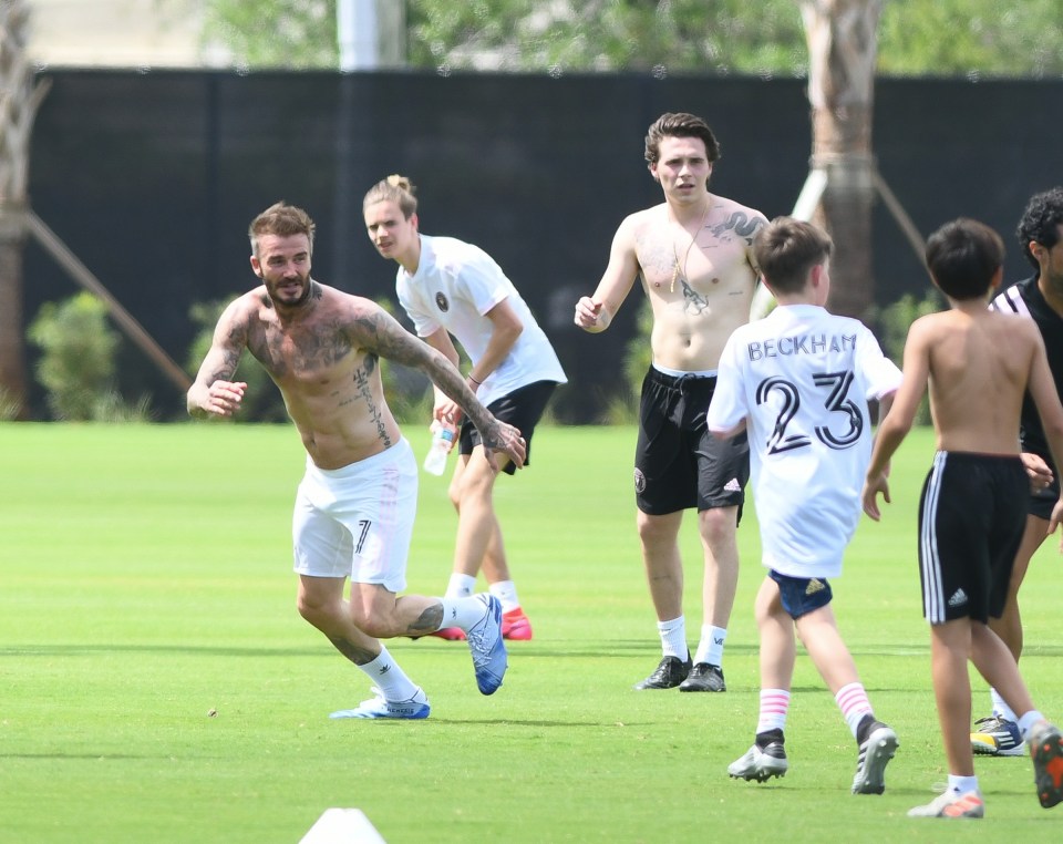  David Beckham worked up a sweat as he played some footy with the kids