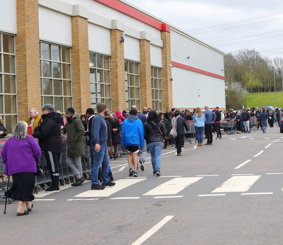 Shoppers queued outside a Costco in Watford today to stock up on food and toilet roll