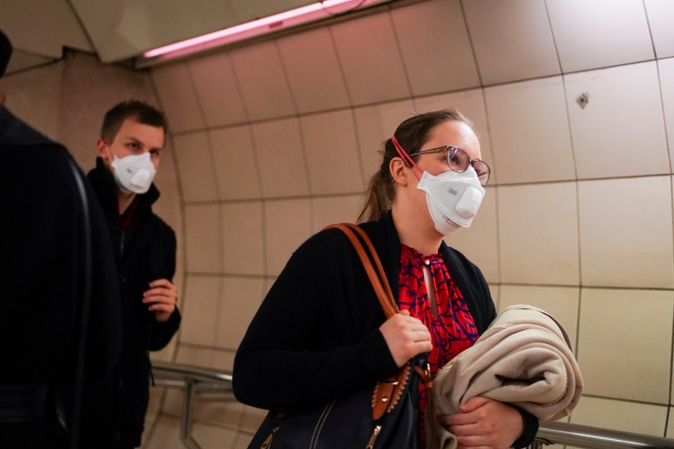  People wear masks on the underground