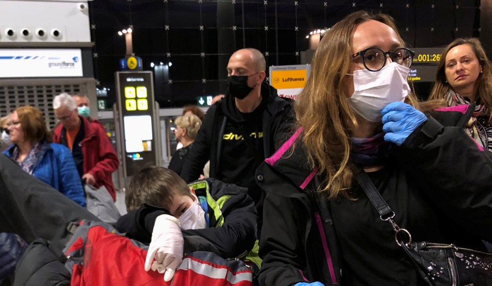  People wait for their flight at the airport in Malaga, Spain