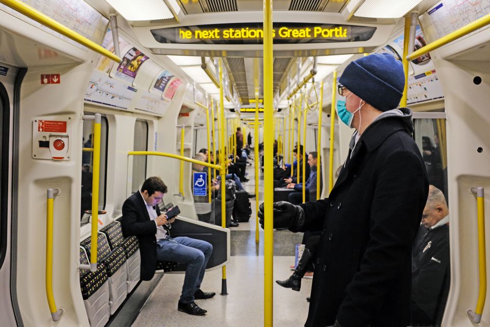  A man wears a face mask on the Tube in central London on Tuesday morning