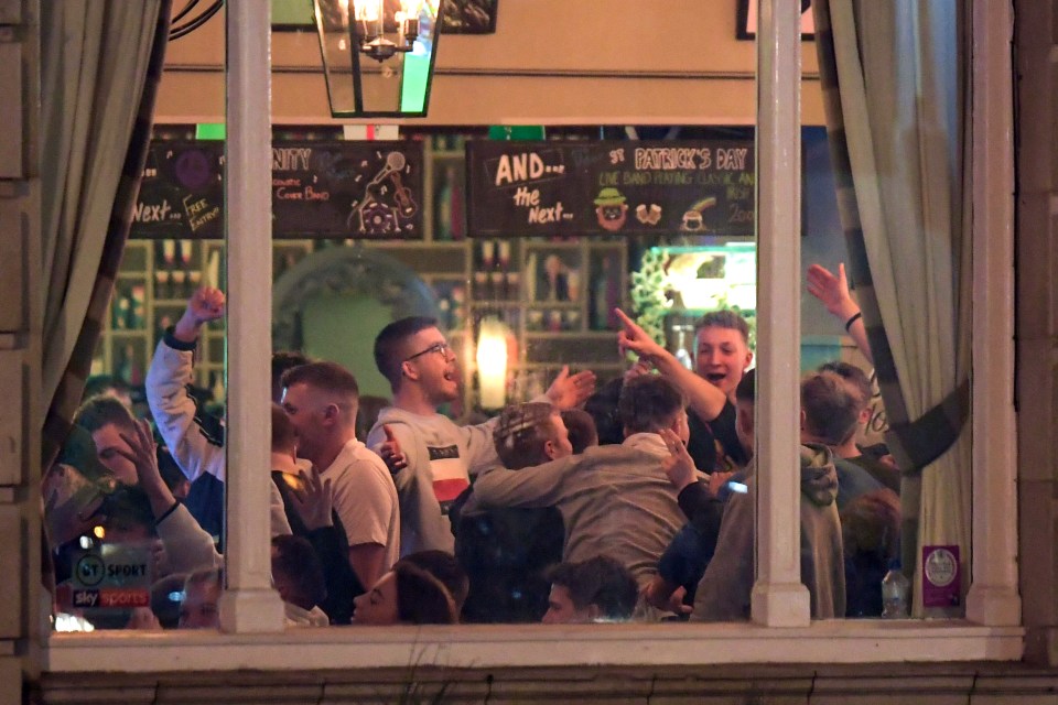  Students sing in a packed pub on St Patrick's day