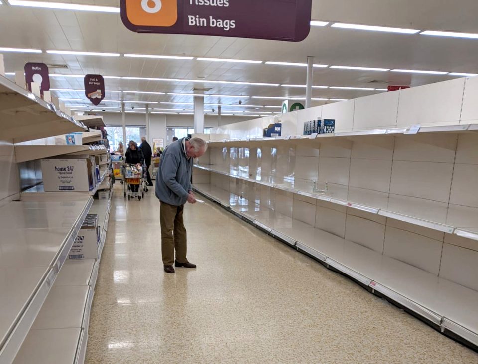  A photograph of an elderly man staring at empty shelves in a Sainsbury's store in Epsom went viral