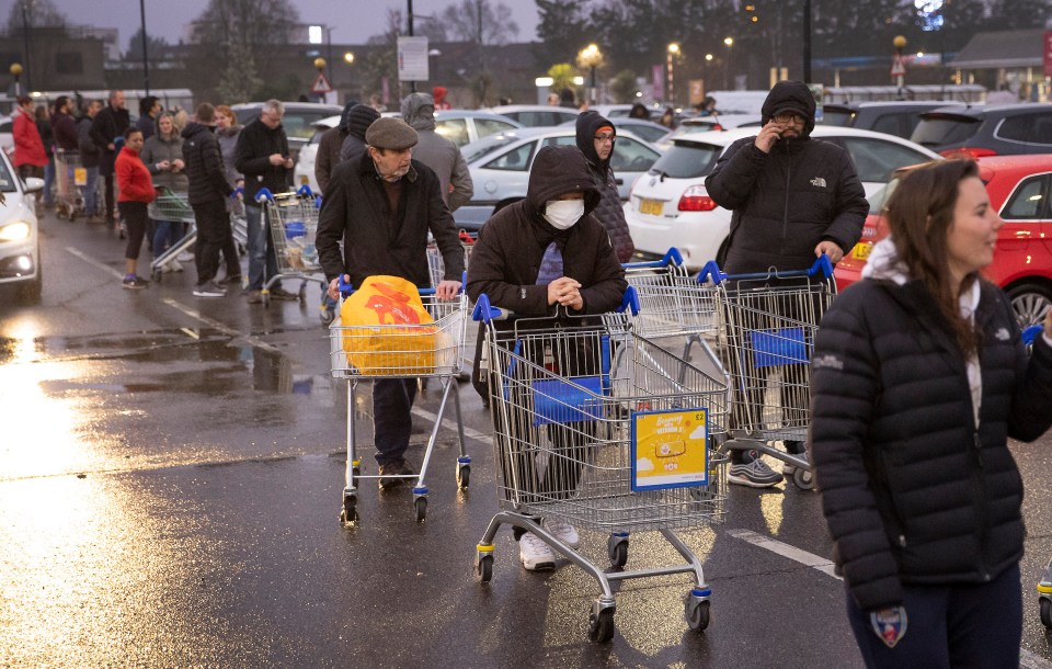  One shopper wears a protective mask to complete their Saturday shop