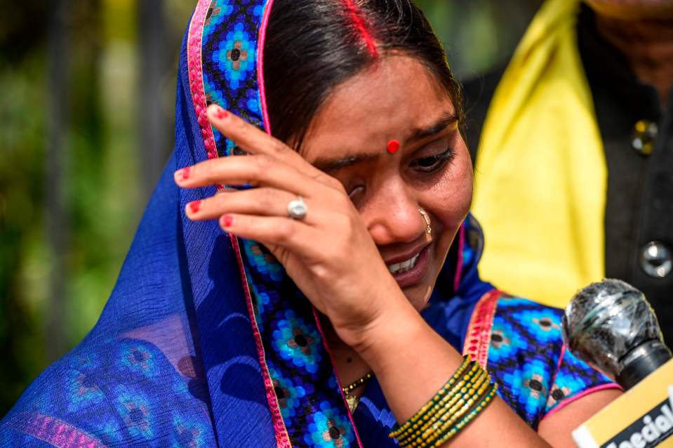  Punita Devi, wife of Akshay Thakur, sobbing outside a court in Delhi as his lawyers staged a last ditched attempt to halt the execution