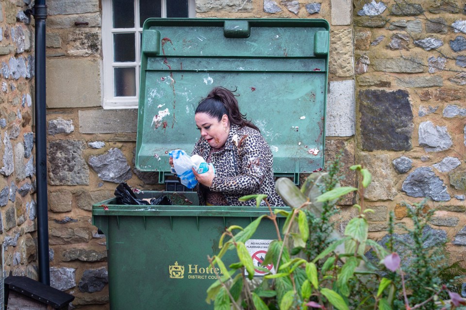  Mandy has a good fish around in the bin behind the cafe for any evidence