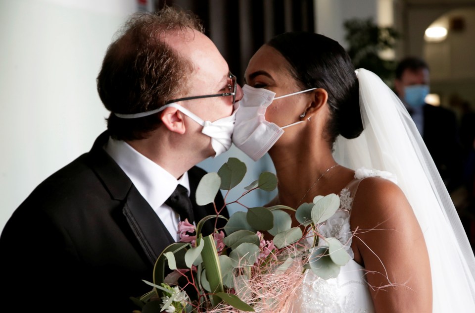 A couple marry in Italy while wearing face masks amid the coronavirus crisis