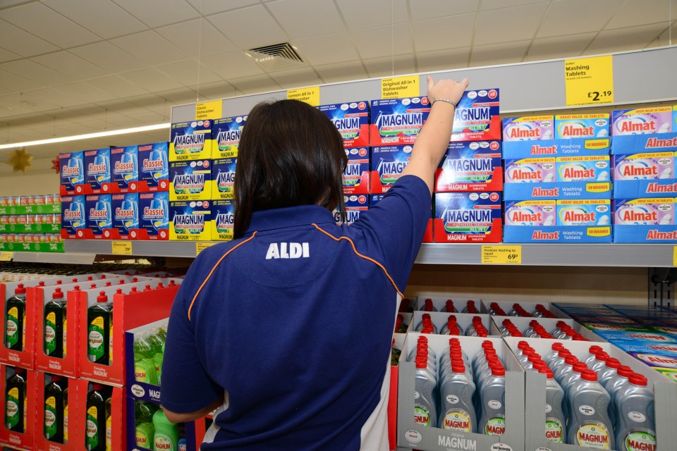 Aldi staff stocking shelves