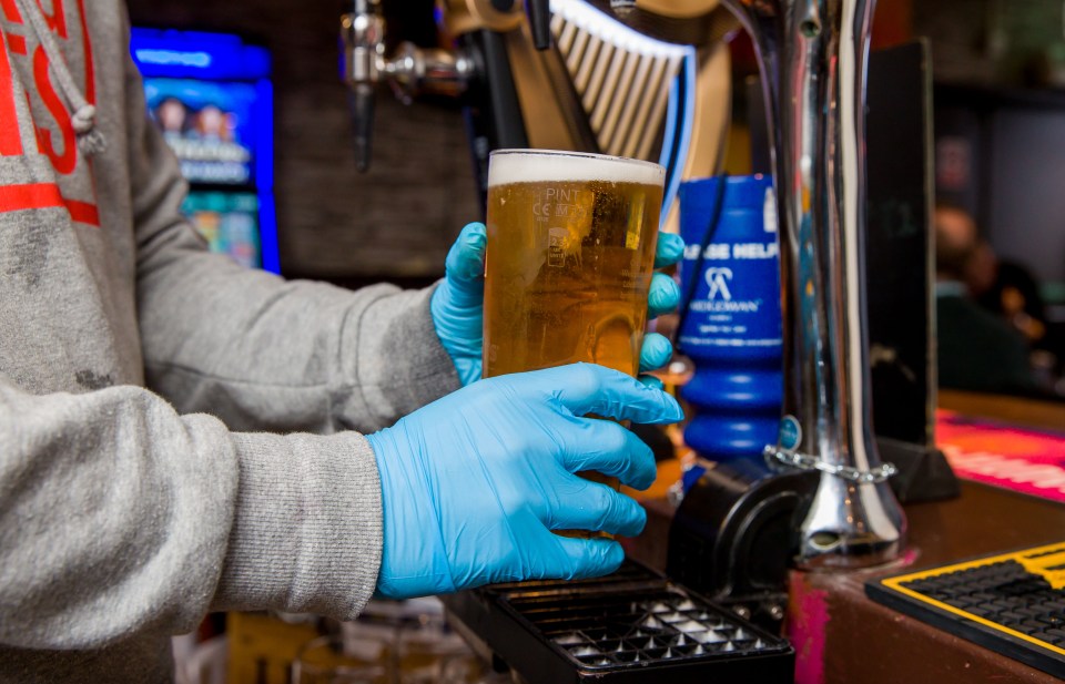 Staff behind the bar were taking precautions and wearing gloves as the killer virus spreads