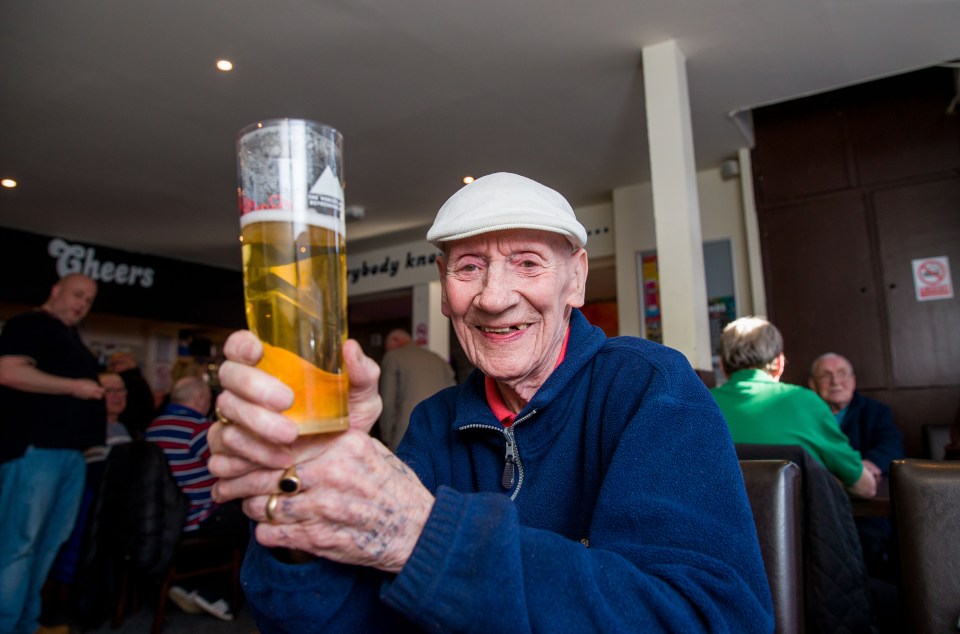 One man looked happy with his pint but Brits have been told not to go to the pub