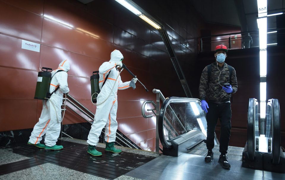  Workers are seen disinfecting a public escalator in Madrid, Spain