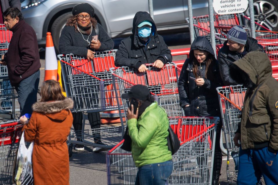  Shoppers queued across the car park