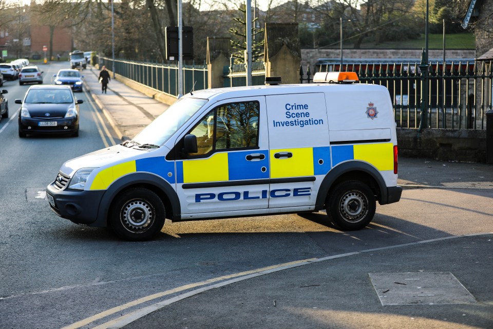  A massive police presence can be seen in Queen Park in Bolton with forensic officers on the scene