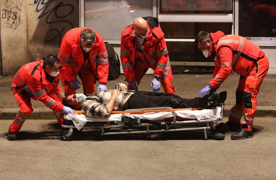  The man is seen being loaded onto a stretcher