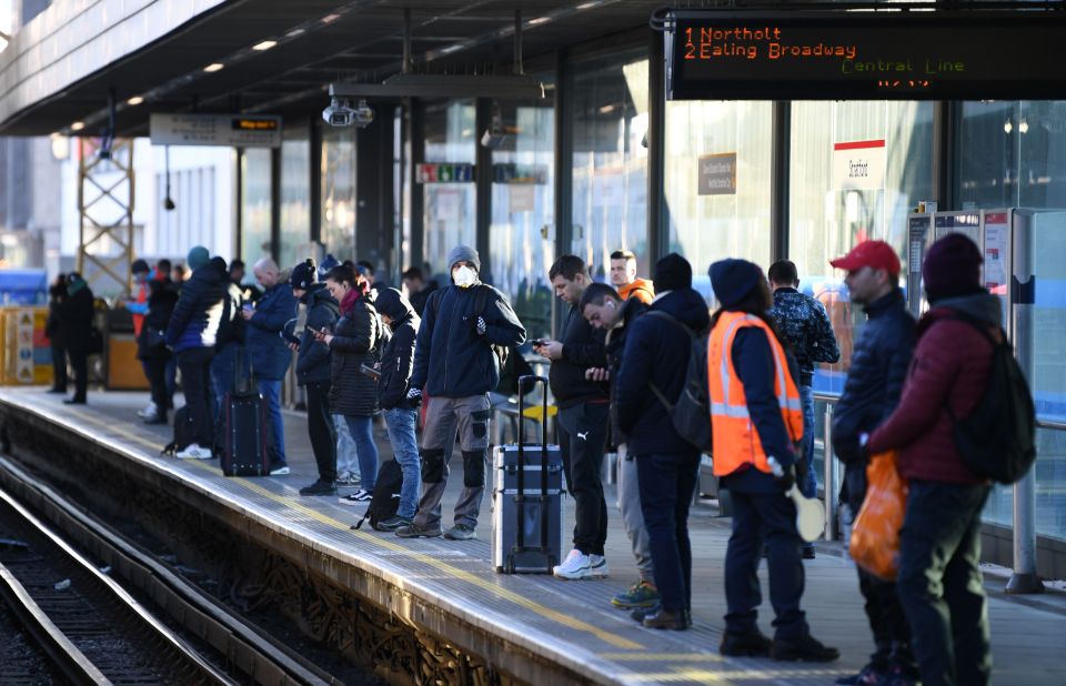  Commuters gather on a platform at Stratford station this morning