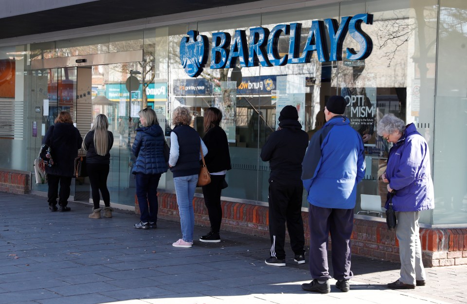  Barclays customers line up outside a branch in St Albans