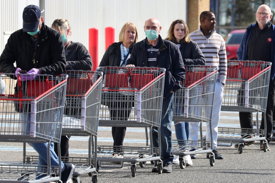 Brits queue up outside a supermarket amid the coronavirus panic