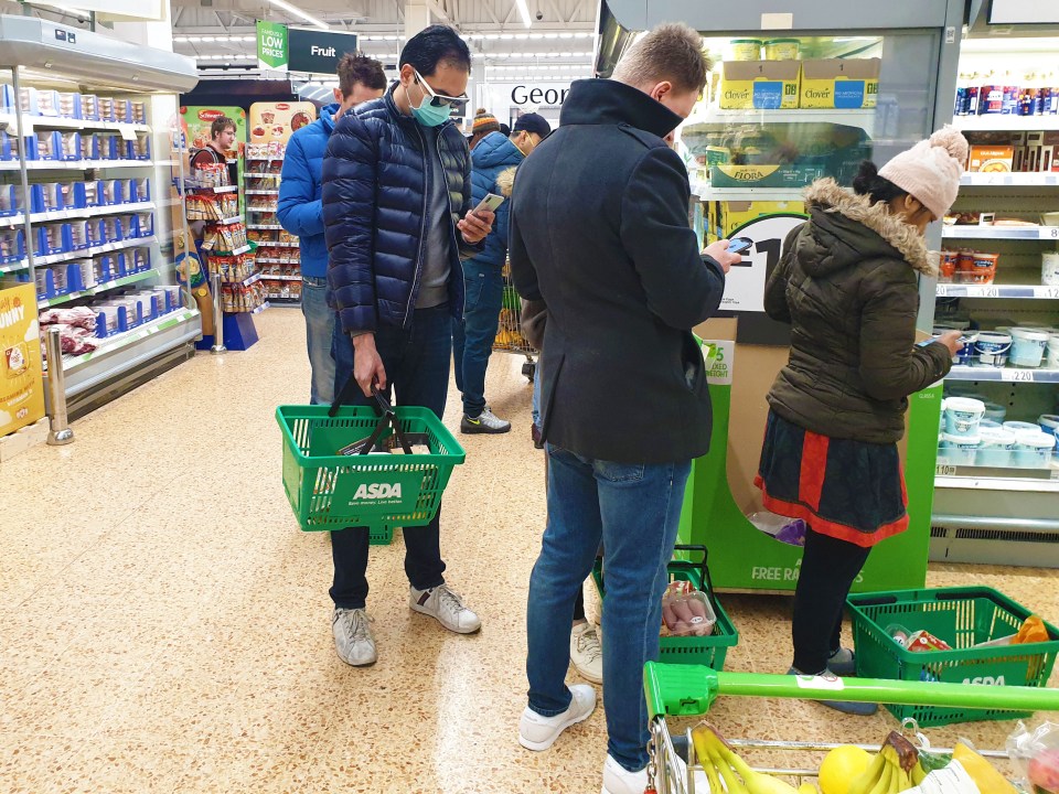  But shoppers do not stick to the government's two-metre social distancing rule when inside an East London Asda