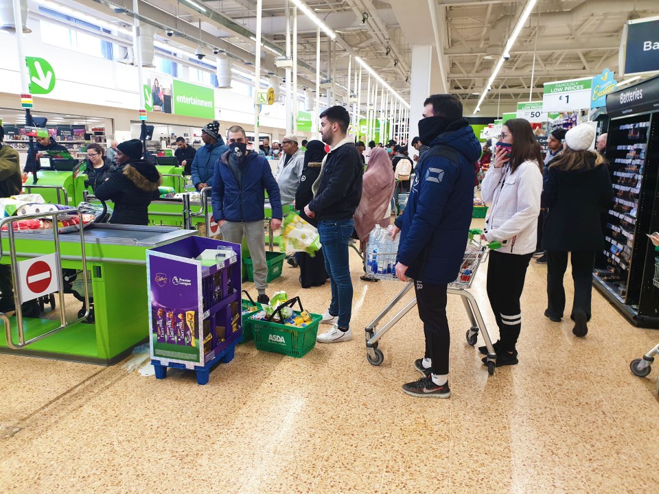  Busy supermarket scenes show shoppers standing close together when they get inside the store