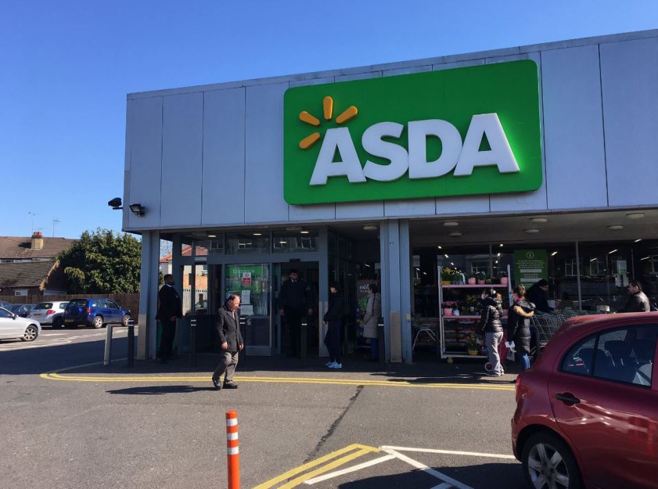  Shoppers pictured outside Asda in South Harrow on Wednesday