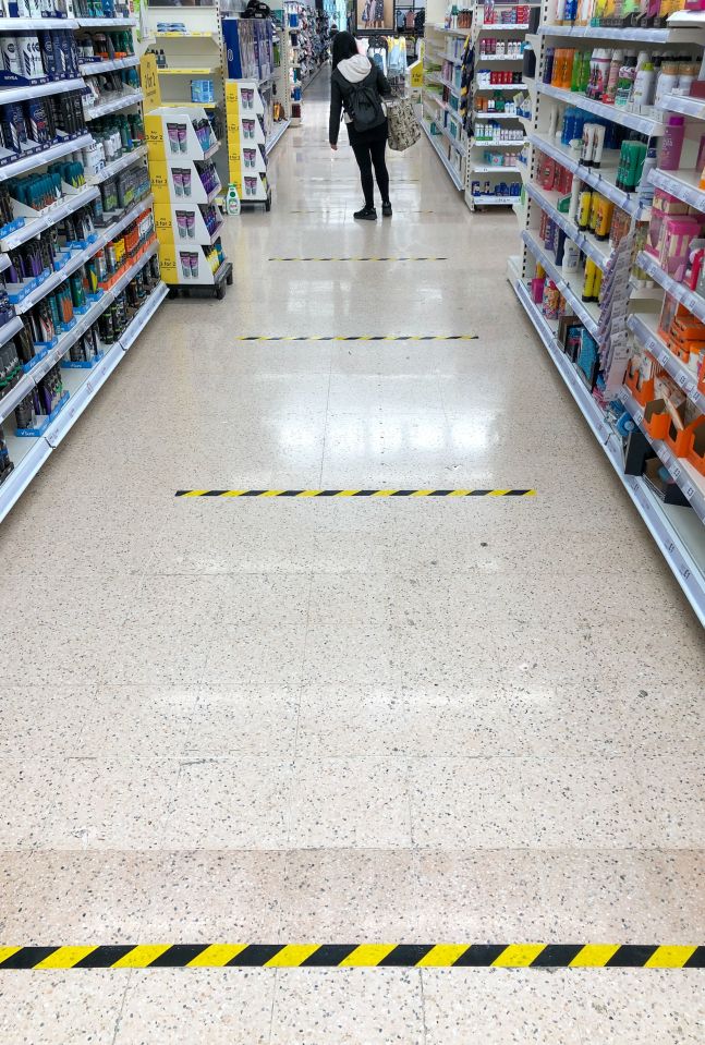  Social distance measures have been introduced in stores as indicated by the markings on the floor