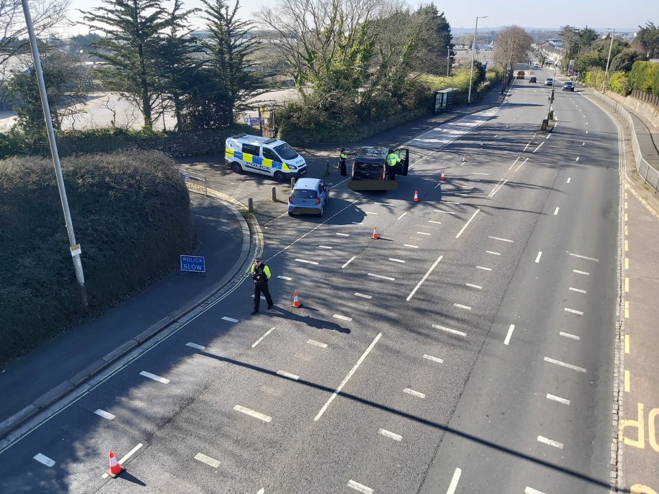 A police stop point in Devon where they are checking that drivers are on essential journeys