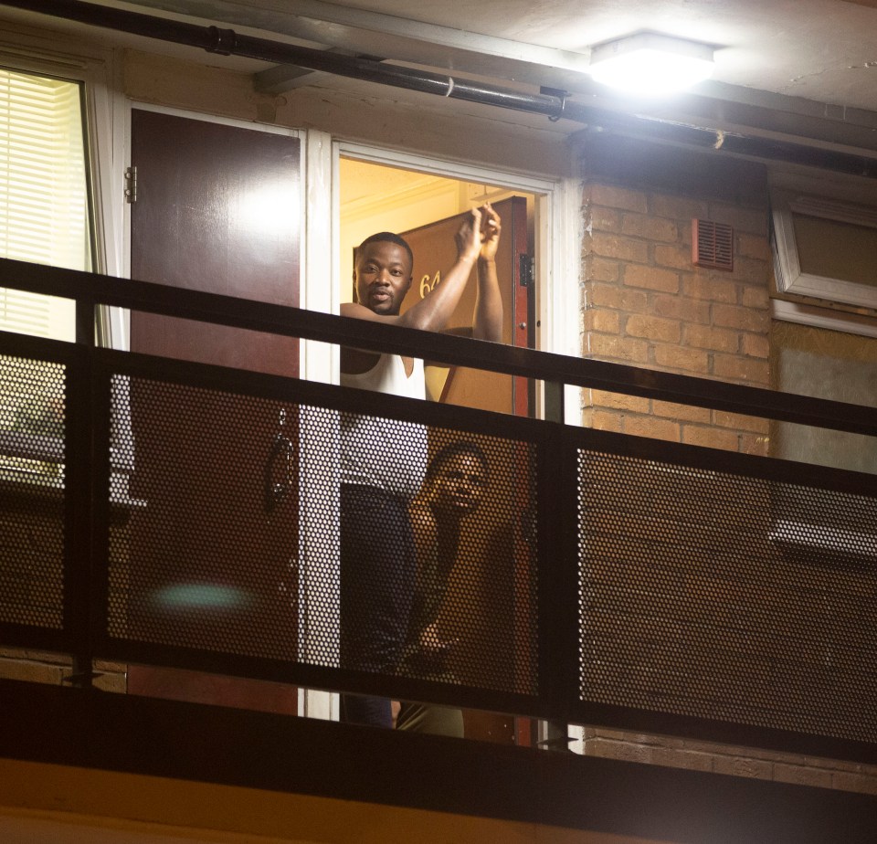 Brits clap from their balcony in support of frontline workers