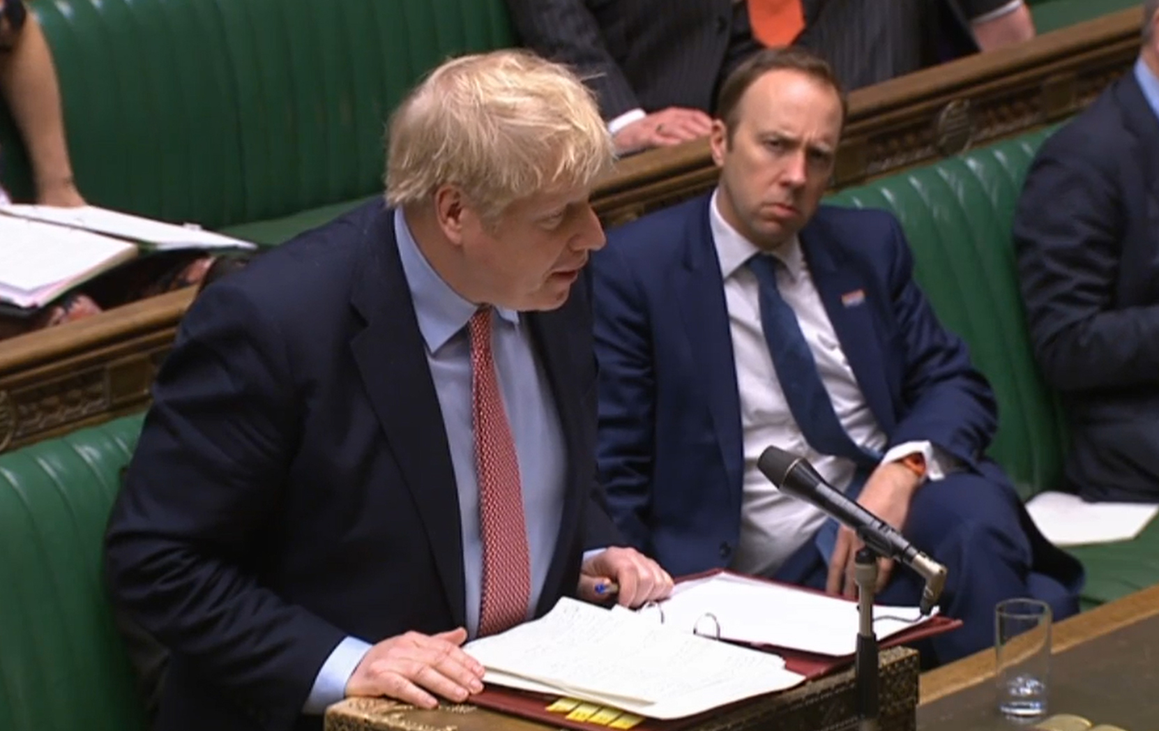 Boris Johnson and Matt Hancock sat closely together during PMQs two days before they announced they had tested positive for Covid-19