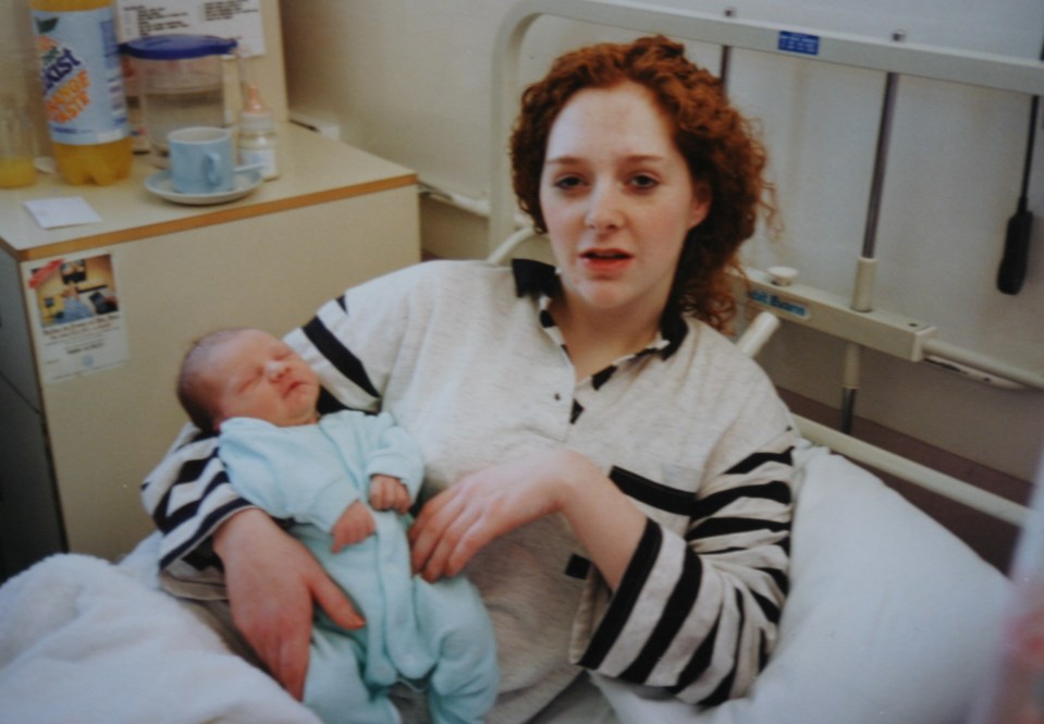  Lisa hugs little Liam as a newborn