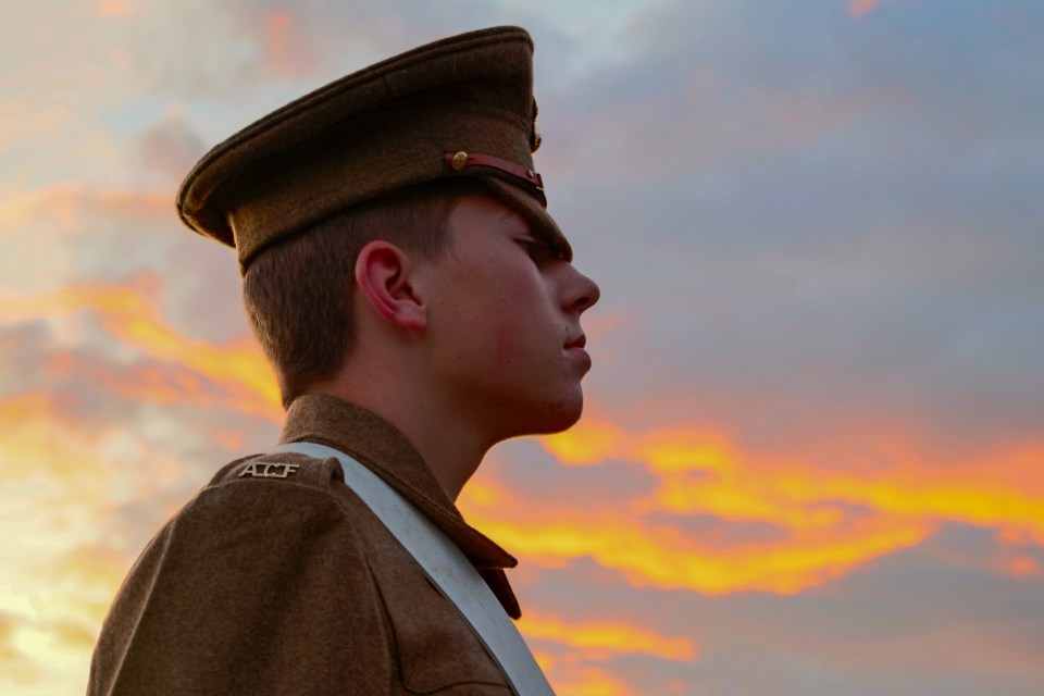  A soldier is seen deep in thought against a sunset background at an annual camp in Ripon, North Yokshire